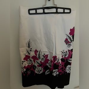 White skirt with pink and black floral pattern